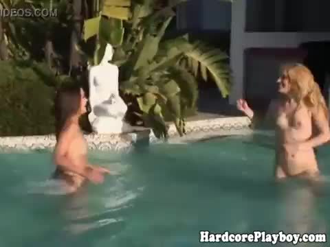 Beautiful petite lesbians by the pool